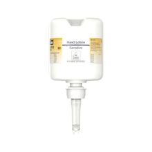 A Tork 420202 hand lotion dispenser in white with a transparent nozzle and the inscription "Sensitive Moisturizing Hand Sanitizer" in small print offers a minimalist design that focuses on dispensing moisturizing lotion, perfect for caring for sensitive skin.