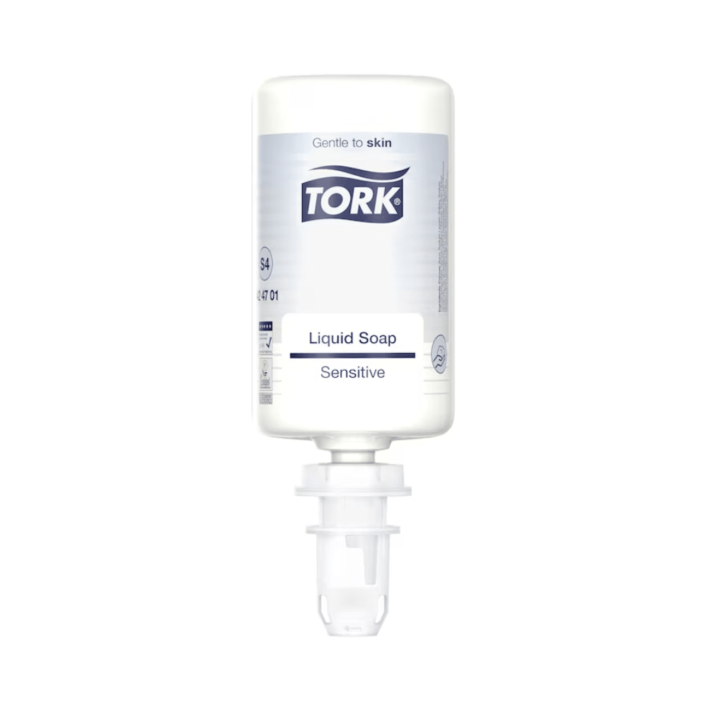 A white bottle of Tork 424701 Sensitive Liquid Soap 1000 ml is seen against a plain background. The label highlights the skin-friendly properties that make the soap ideal for sensitive skin. The bottle features a dispensing nozzle and emphasizes its gentle effect with natural ingredients.