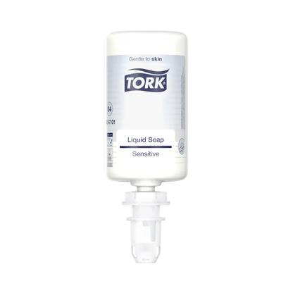 A white bottle of Tork 424701 Sensitive Liquid Soap 1000 ml is seen against a plain background. The label highlights the skin-friendly properties that make the soap ideal for sensitive skin. The bottle features a dispensing nozzle and emphasizes its gentle effect with natural ingredients.