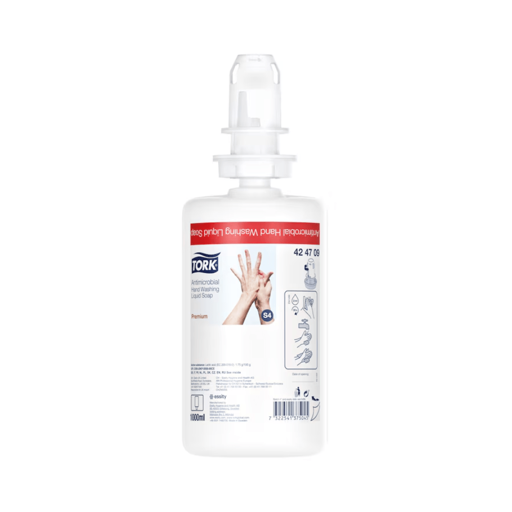 A bottle of Tork 424709 Antimicrobial Liquid Soap, enriched with plant-based ingredients, shows a diagram of washing hands, features a pump dispenser, and has a product volume of 1000 ml. The white bottle is decorated with red and blue text and graphics.