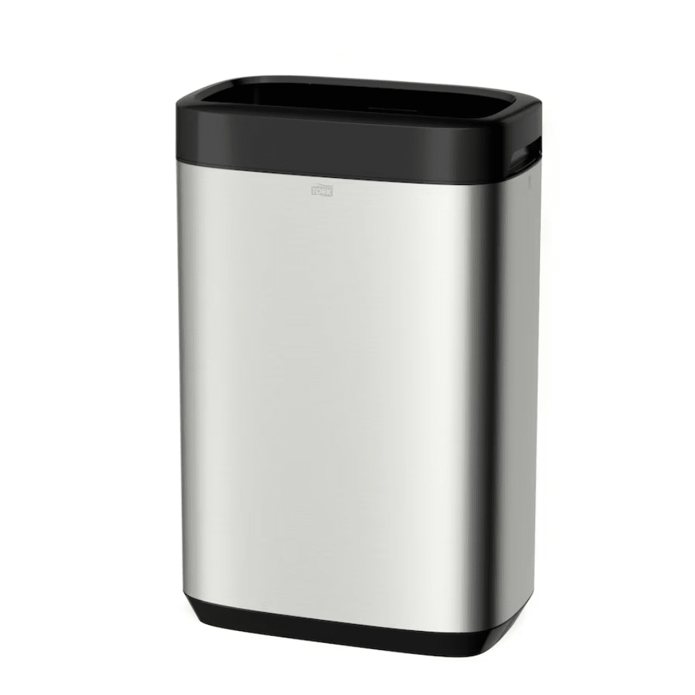 The Tork 460011 Tork Waste Bin Image Line, presented by TORK – Essity Professional Hygiene Germany GmbH, is a sleek and minimalist rectangular trash can made of stainless steel with a black lid and base. Its stainless steel design offers a considerable capacity of 50 liters, combining style with functionality and features a small handle for easy opening.