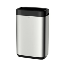 The Tork 460011 Tork Waste Bin Image Line, presented by TORK – Essity Professional Hygiene Germany GmbH, is a sleek and minimalist rectangular trash can made of stainless steel with a black lid and base. Its stainless steel design offers a considerable capacity of 50 liters, combining style with functionality and features a small handle for easy opening.