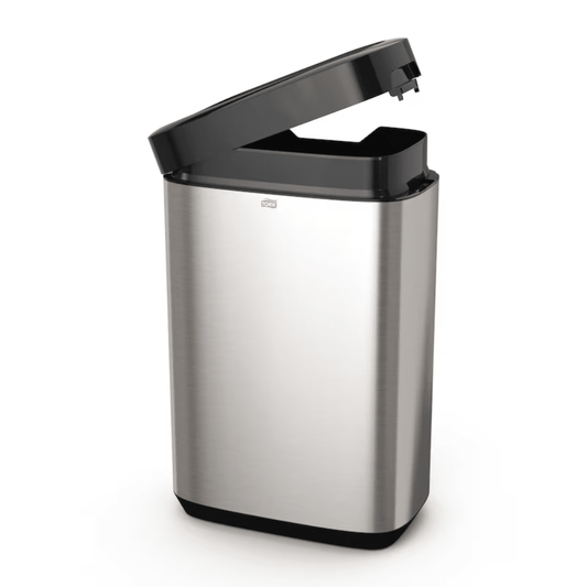 The Tork 460011 Tork waste bin from the Image Line series by TORK – Essity Professional Hygiene Germany GmbH features a sleek, open stainless steel design with a black sensor-activated lid. Its slim stainless steel design offers a 50-liter capacity and a rectangular shape with a smooth surface, making it ideal for modern spaces.