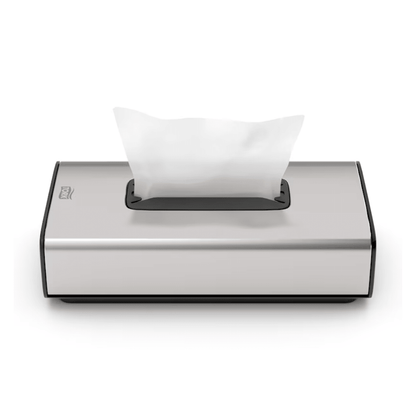 We present the Tork 460013 dispenser for cosmetic tissues Image Line F1 from Essity Professional Hygiene Germany GmbH. This elegant silver tissue dispenser features a modern rectangular design with a stainless steel design finish. It has a single sheet dispensing function, allowing a white tissue to be partially pulled out from the top opening, and its minimalist appearance makes it ideal for cosmetic tissues.