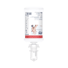 A transparent and white bottle of Tork 520202 alcohol-free hand sanitizing foam Premium S4 from TORK – Essity Professional Hygiene Germany GmbH. The bottle is inverted and equipped with a dispensing nozzle to promote sustainable hand hygiene. The label contains instructions for use and product details in multiple languages.