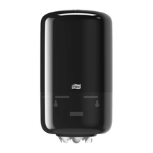 The Tork 558008 Mini Centerfeed Dispenser Elevation M1 by TORK – Essity Professional Hygiene Germany GmbH is a black, wall-mounted paper towel dispenser with an elegant, rounded Elevation design. It features a transparent section at the bottom to show the roll inside, ensuring better hygiene. The Tork logo is clearly visible on the front.