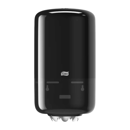 The Tork 558008 Mini Centerfeed Dispenser Elevation M1 by TORK – Essity Professional Hygiene Germany GmbH is a black, wall-mounted paper towel dispenser with an elegant, rounded Elevation design. It features a transparent section at the bottom to show the roll inside, ensuring better hygiene. The Tork logo is clearly visible on the front.
