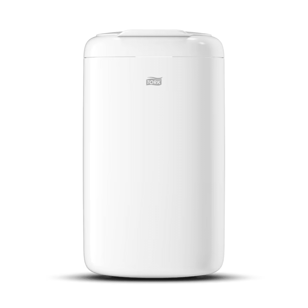The Tork 564000 Mini Waste Bin Elevation from TORK – Essity Professional Hygiene Germany GmbH is a stylish, white, cylindrical waste bin. With a smooth exterior and a lid with the distinctive Tork logo, this 5-liter hygiene waste bin complements its pure white surroundings with practical elegance.
