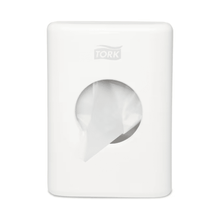 The Tork 566000 dispenser for hygiene bags Elevation B5 from Essity Professional Hygiene Germany GmbH combines style and functionality with its white, rectangular design and round opening, offering an elegant yet practical addition that dispenses a fresh, white towel and enhances the elegance of any bathroom.