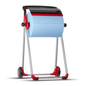 A Tork 652008 roll dispenser floor stand Performance W1, brand TORK – Essity Professional Hygiene Germany GmbH, holds a large paper towel roll and is equipped with wheels for mobility. The dispenser features an elegant red-black design and has a robust metal frame and a serrated edge to facilitate tearing off the sheets.