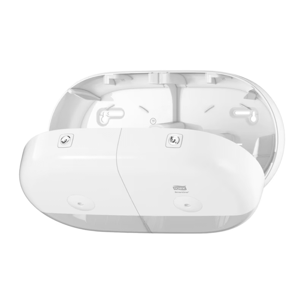 The Tork SmartOne® 682000 Mini Toilet Paper Dispenser for T9 Paper, manufactured by TORK – Essity Professional Hygiene Germany GmbH, is presented in pristine white. This wall-mounted dispenser impresses with an elegant, modern aesthetic and is openly displayed to highlight its internal components. Next to it stands the elegant and efficient Tork SmartOne system with two main compartments designed for easy installation and attachment with visible screws.