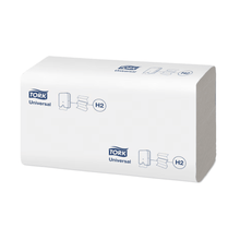 A stack of Tork Xpress® 150100 Multifold Hand Towels Universal H2, wrapped in an elegant white packaging, displays the TORK logo and illustrations of the folded hand towels. Ideal for anyone looking for good value for money. These come from Essity Professional Hygiene Germany GmbH.