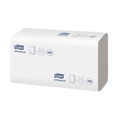 A stack of Tork Xpress® 150100 Multifold Hand Towels Universal H2, wrapped in an elegant white packaging, displays the TORK logo and illustrations of the folded hand towels. Ideal for anyone looking for good value for money. These come from Essity Professional Hygiene Germany GmbH.