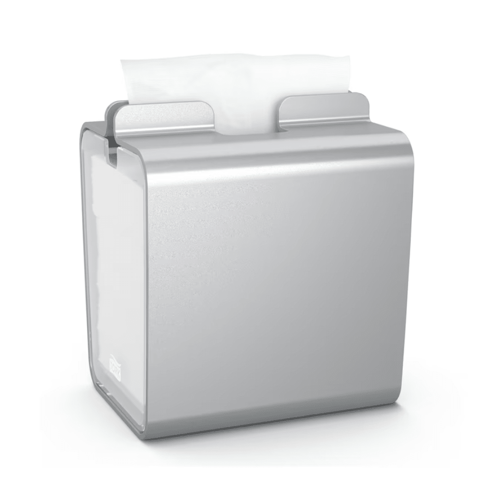 A rectangular Tork Xpressnap® 274002 napkin dispenser made of aluminum with a single white napkin that is easily pulled down from the top, features an elegant metallic finish. Its compact design makes it ideal for kitchens or self-service restaurants.