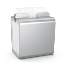 A rectangular Tork Xpressnap® 274002 napkin dispenser made of aluminum with a single white napkin that is easily pulled down from the top, features an elegant metallic finish. Its compact design makes it ideal for kitchens or self-service restaurants.