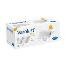 The image shows a package of Hartmann Varolast® Plus zinc paste bandage, containing a zinc paste bandage measuring 10 cm x 7 m. The packaging includes product images, hexagonal graphics, the Paul Hartmann AG logo, and multilingual descriptions. It is designed for conditions such as edema and phlebitis.