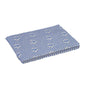 A piece of folded fabric with a blue geometric pattern with small animal prints, reflecting the design of the "Original Floorcloth" by Vileda Professional.
