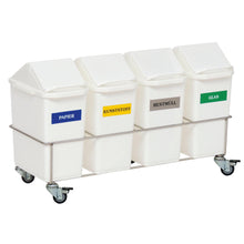 The Novocal room waste collector fourfold collector has four containers with lids and colored labels for paper, plastic, residual waste, and glass on a stainless steel frame with wheels - ideal for efficient waste separation in any room.
