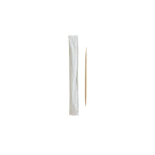 An environmentally friendly PAPSTAR "pure" wooden toothpick lies next to a treated white individual package on a plain white background.