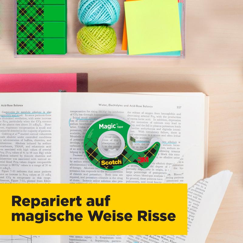 A roll of Scotch® Magic™ Invisible Tape (19 mm x 25 mm, incl. 5 m free) by 3M Deutschland GmbH lies on a book next to twine, sticky notes, and paper clips. A banner says: "Magically repairs tears."