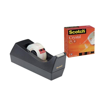 A Scotch™ C38 desktop dispenser black with a 19 mm x 10 m roll of Scotch® Crystal Tape from 3M Deutschland GmbH stands next to the orange "Scotch Crystal" box with images of clear tape rolls.