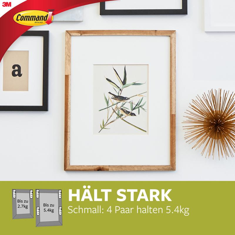 A framed plant print hangs on a white wall with other frames and a gold object. Below, the Narrow Command™ Picture Hanging Strips (M) 17207 from 3M Deutschland GmbH are advertised for their residue-free removable and strong holding power.
