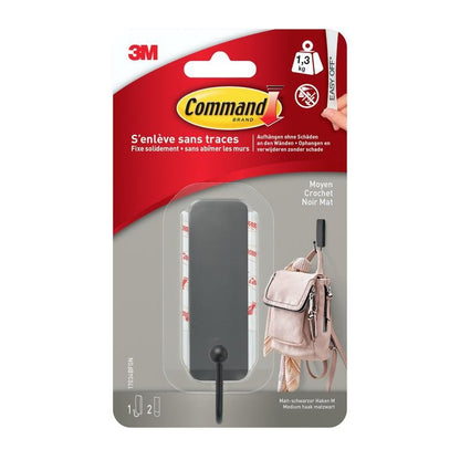 A package with 1 medium-sized Command™ matte black hook, 17034B, and 2 strips from 3M Deutschland GmbH, depicted with a backpack - ideal as a wall hook without drilling. Includes bilingual text and branding.