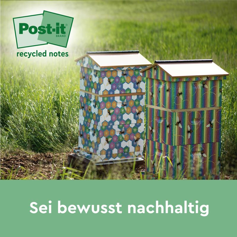 Two colorful beehives with hexagonal patterns stand on a meadow in the sunlight. In the corner is the logo of Post-it® Recycling Notes, 38 mm x 51 mm, 100 sheets/block, 100% PEFC by 3M Deutschland GmbH. The text below reads: "Be consciously sustainable."