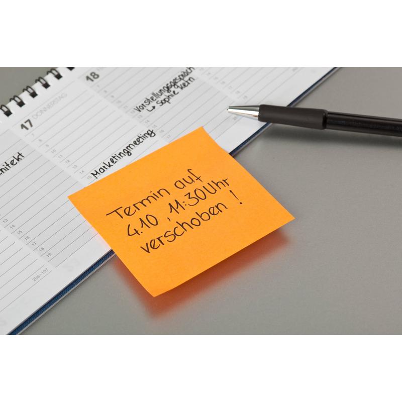 A black pen, an open planner, and a Post-it® note from 3M Deutschland GmbH (76 mm x 76 mm, 100 sheets/block, 100% PEFC) with the inscription "Appointment on 4.10., 11:30 AM postponed!" placed on the planner.