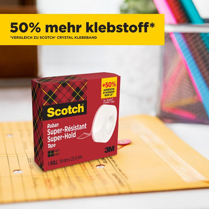 A box of Scotch® Super-Hold Secure Tape, 1 roll, 19 mm x 25.4 m (3M Deutschland GmbH), with red-green checkered packaging, lies next to a sealed Manila envelope. A yellow banner with the inscription "50% more adhesive*" is above the box.