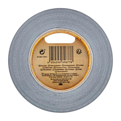 A roll of Scotch® Universal Tape 2904 (50 m x 48 mm) from 3M Deutschland GmbH, viewed from above, stands out for its gray color and a central label with barcode and product information in multiple languages.
