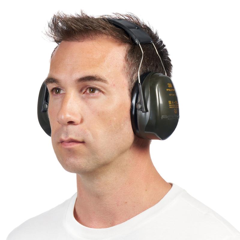 A man with short brown hair, in a simple white shirt, wears large green 3M™ PELTOR™ Optime™ II H520A ear muffs (SNR 31 dB, 1 piece) from 3M Deutschland GmbH, slightly turned to the left against a white background.
