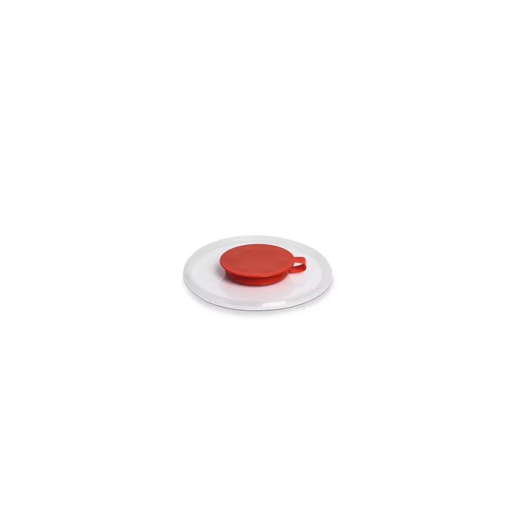 A Dr. Schumacher small natural bucket lid with red extraction from Dr. Schumacher GmbH is centered on a round white plate against a plain white background.