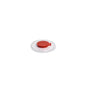 A Dr. Schumacher small natural bucket lid with red extraction from Dr. Schumacher GmbH is centered on a round white plate against a plain white background.