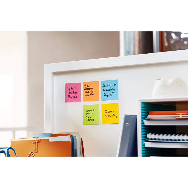 A white office partition with 3M Post-it® Super Sticky Notes (47.6 mm x 47.6 mm), reminders for benefits, training, paper orders, a team meeting, and forms for new employees, as well as a tape dispenser and various accessories.
