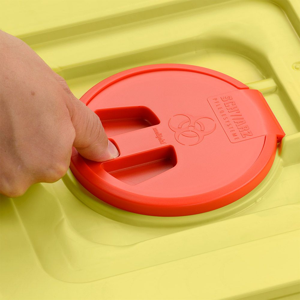 A hand presses on the red lid of a yellow 12-liter disposal container from Helmut Schwarz GmbH melijekt (20 pieces per box), embossed with the biohazard symbol and the lettering "SHARPMAX".