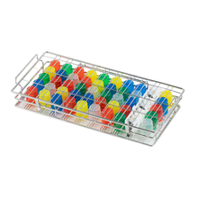 A stainless steel frame, similar to the melipul cup rinsing basket made of stainless steel in large from Helmut Schwarz GmbH, holds rows of bright plastic pipette tips in red, yellow, green, blue, and white. It is ideal for laboratory use and ensures hygienic cleaning and features a convenient handle on one side.